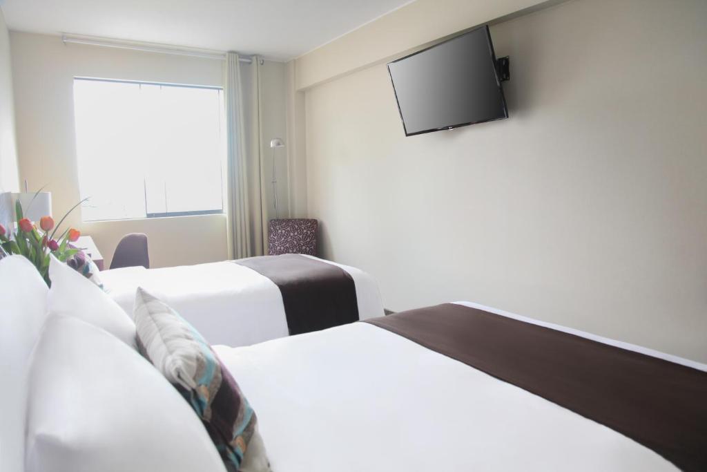 Postel nebo postele na pokoji v ubytování Hotel Rivera Inn