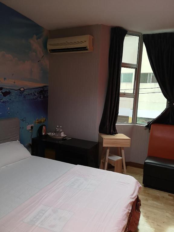 Postel nebo postele na pokoji v ubytování Home Inn Hotel