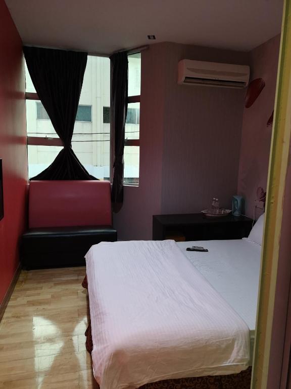 Postel nebo postele na pokoji v ubytování Home Inn Hotel