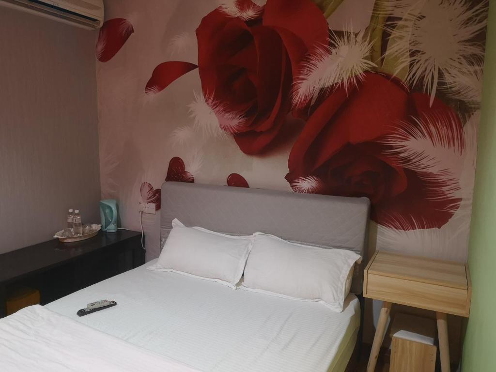 Postel nebo postele na pokoji v ubytování Home Inn Hotel