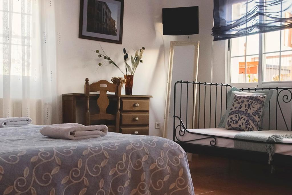 Posteľ alebo postele v izbe v ubytovaní Habitaciones Casa Rural El Sauce