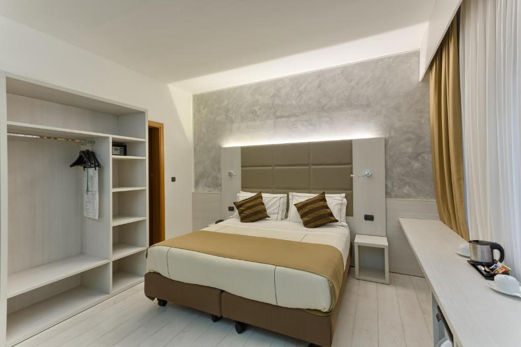 Postel nebo postele na pokoji v ubytování Agape Hotel AA Hotels