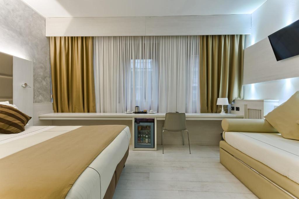 TV a/nebo společenská místnost v ubytování Agape Hotel AA Hotels
