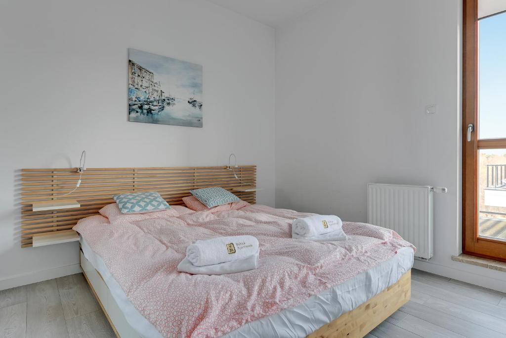 Posteľ alebo postele v izbe v ubytovaní Golden Bay by Nadmorski Dwór Apartments