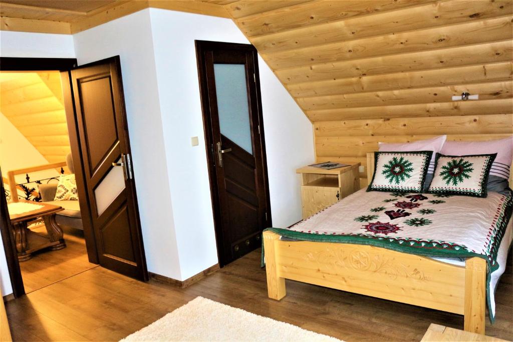 Posteľ alebo postele v izbe v ubytovaní Szostak Apartament