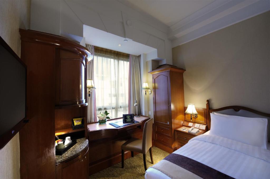 Letto o letti in una camera di Charterhouse Causeway Bay