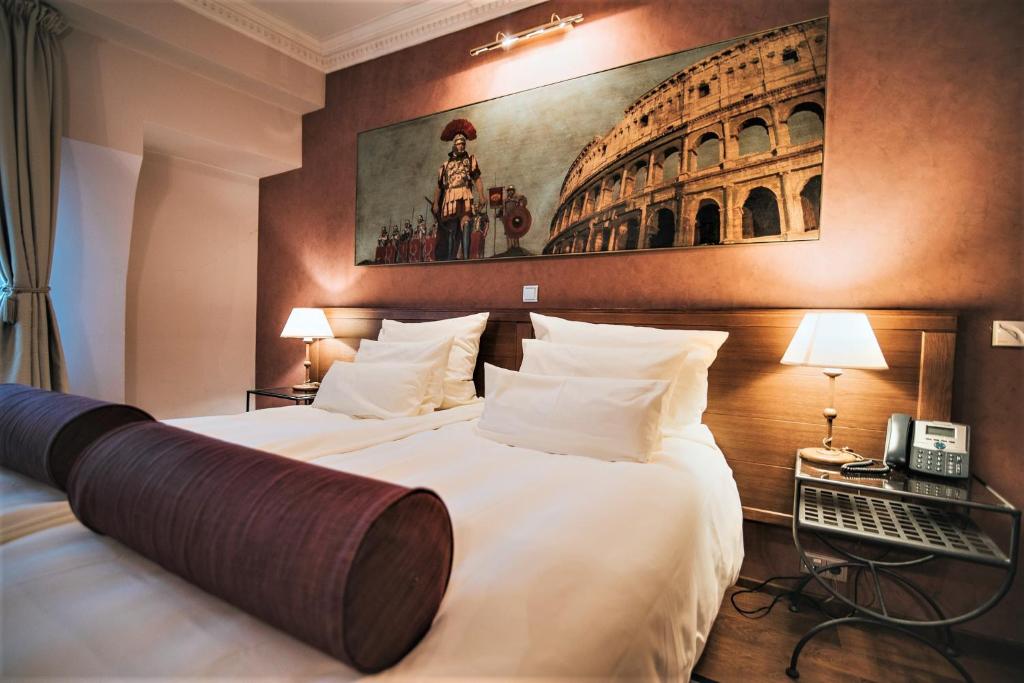 Ένα ή περισσότερα κρεβάτια σε δωμάτιο στο Hotel Mitra, Story Hotels