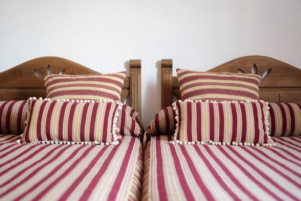 Posteľ alebo postele v izbe v ubytovaní Habitaciones Casa Rural El Sauce