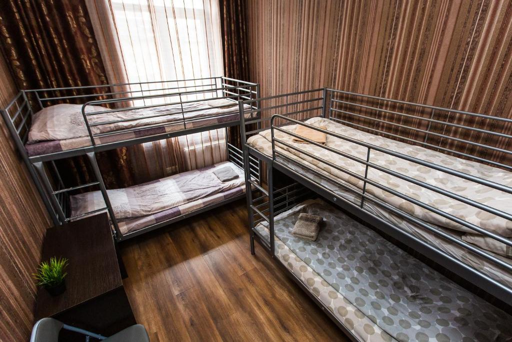 an overhead view of two bunk beds in a room at Baker's street in Lviv