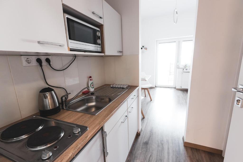 Kuchyň nebo kuchyňský kout v ubytování Hilltop Apartments