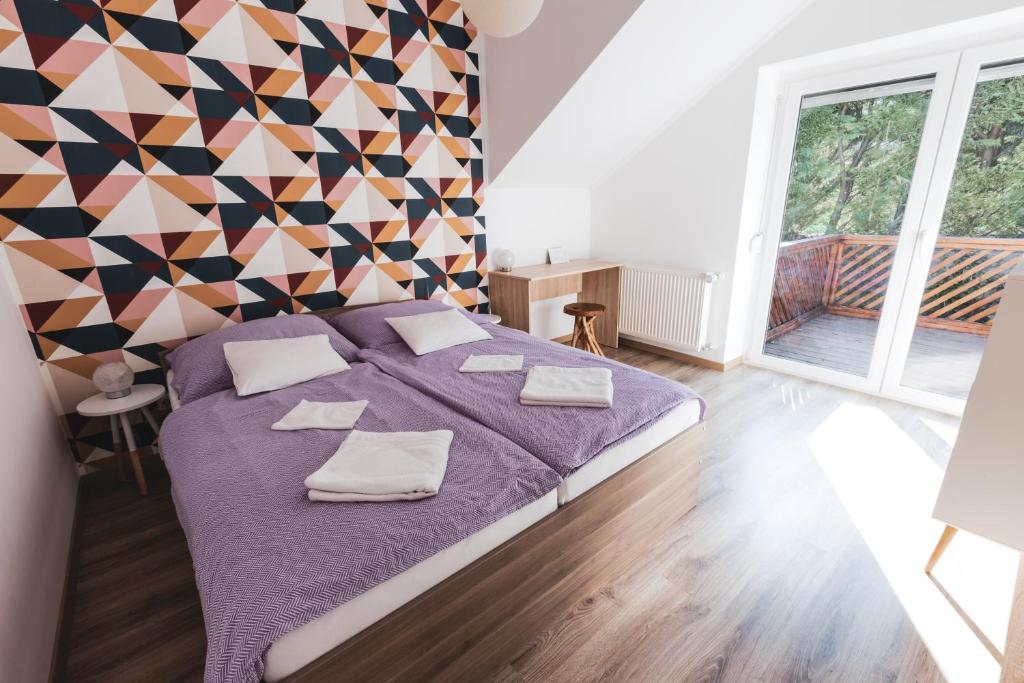 Postel nebo postele na pokoji v ubytování Hilltop Apartments