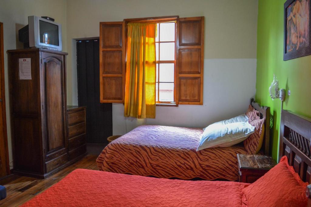 Postel nebo postele na pokoji v ubytování Hostal del Piamonte