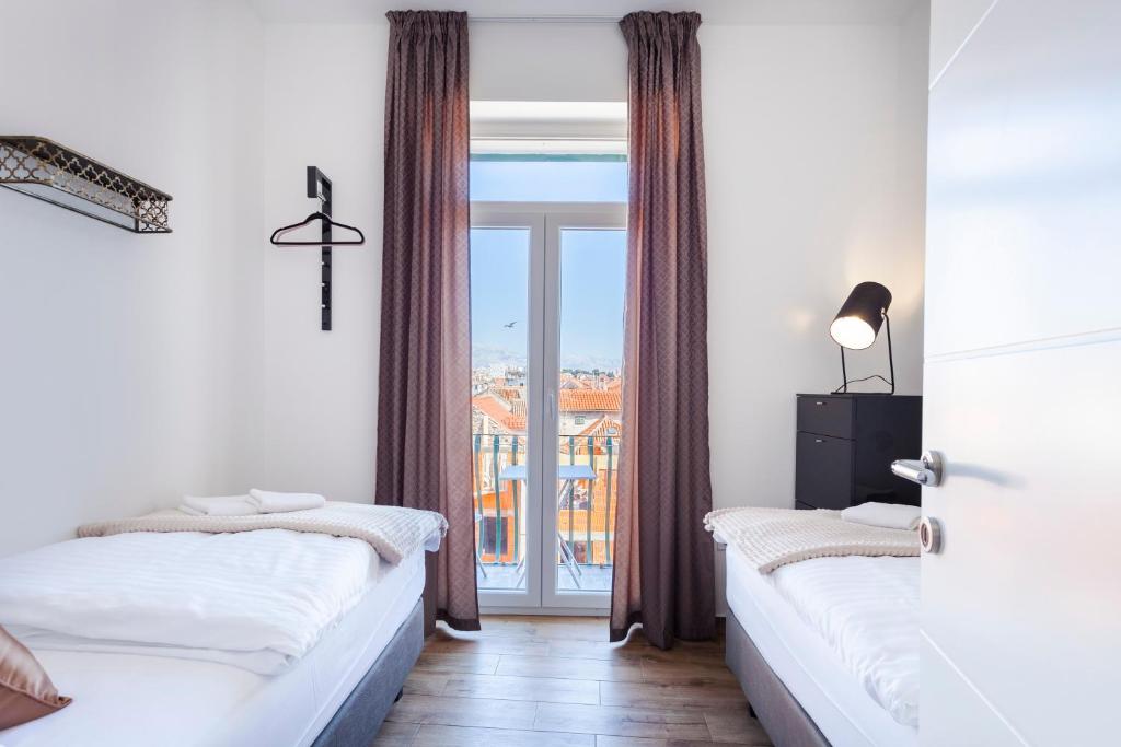 Posteľ alebo postele v izbe v ubytovaní Cozy Apartment Lile in the heart of old town Split