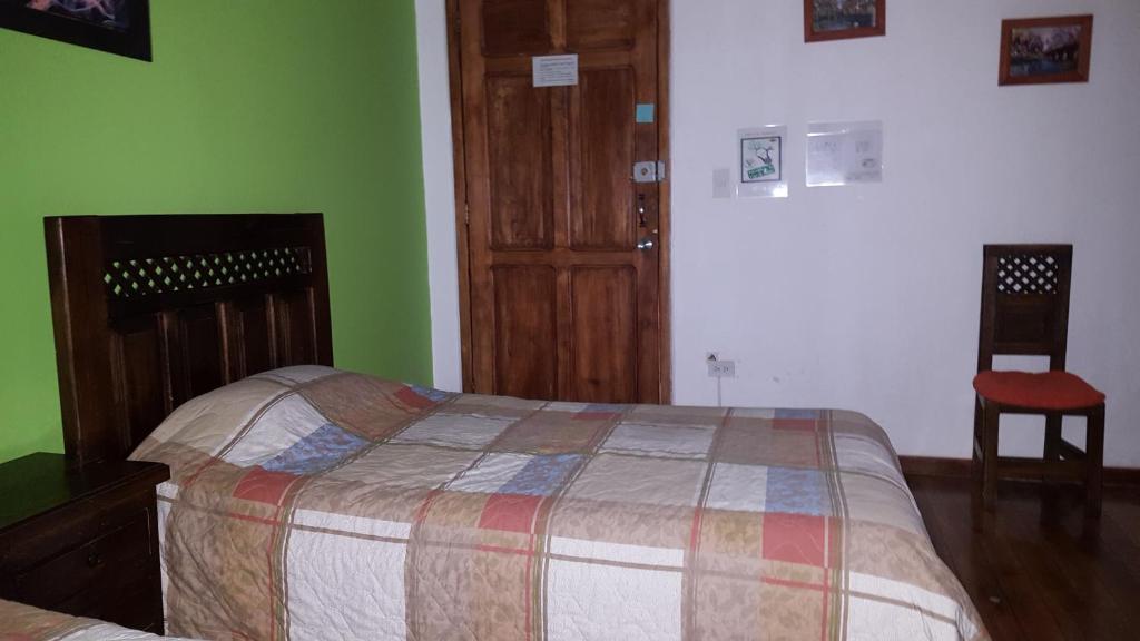 Postel nebo postele na pokoji v ubytování Hostal del Piamonte