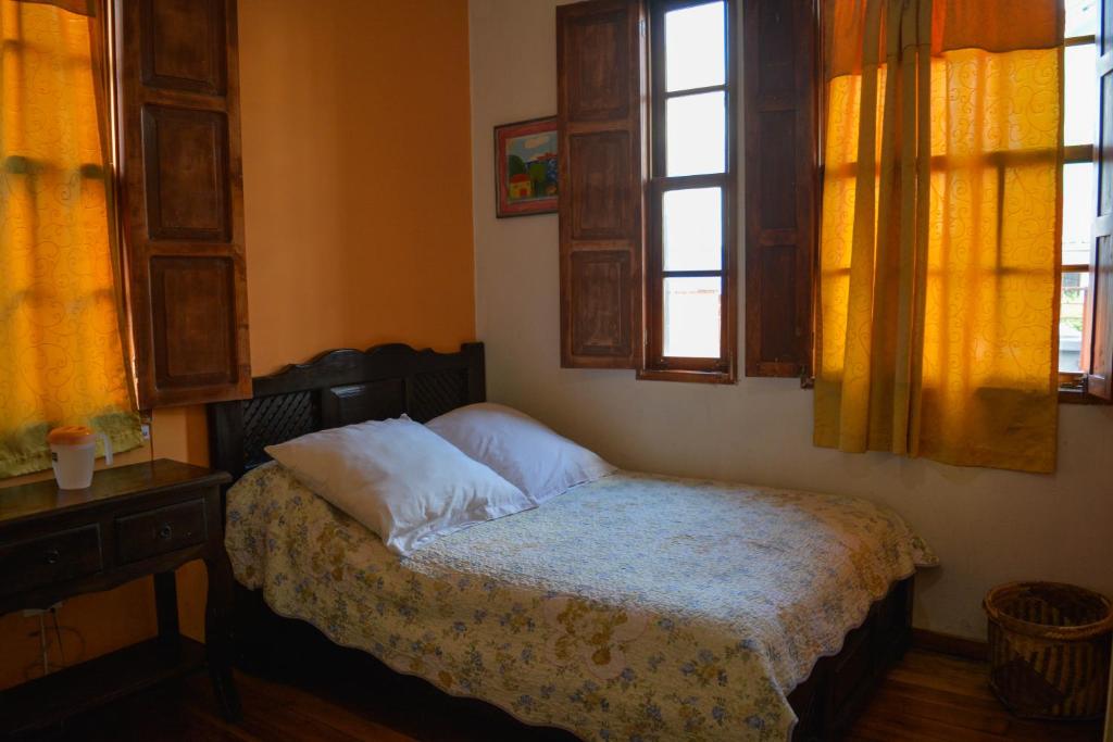 Postel nebo postele na pokoji v ubytování Hostal del Piamonte
