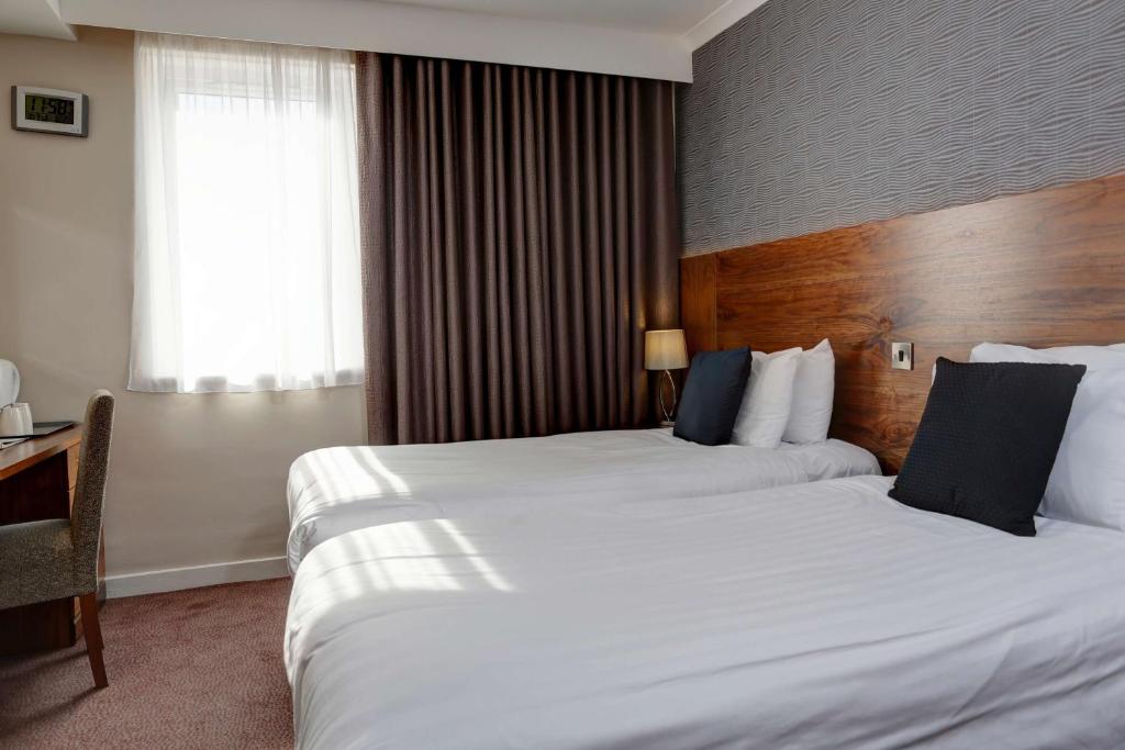 Postel nebo postele na pokoji v ubytování Best Western Kings Manor