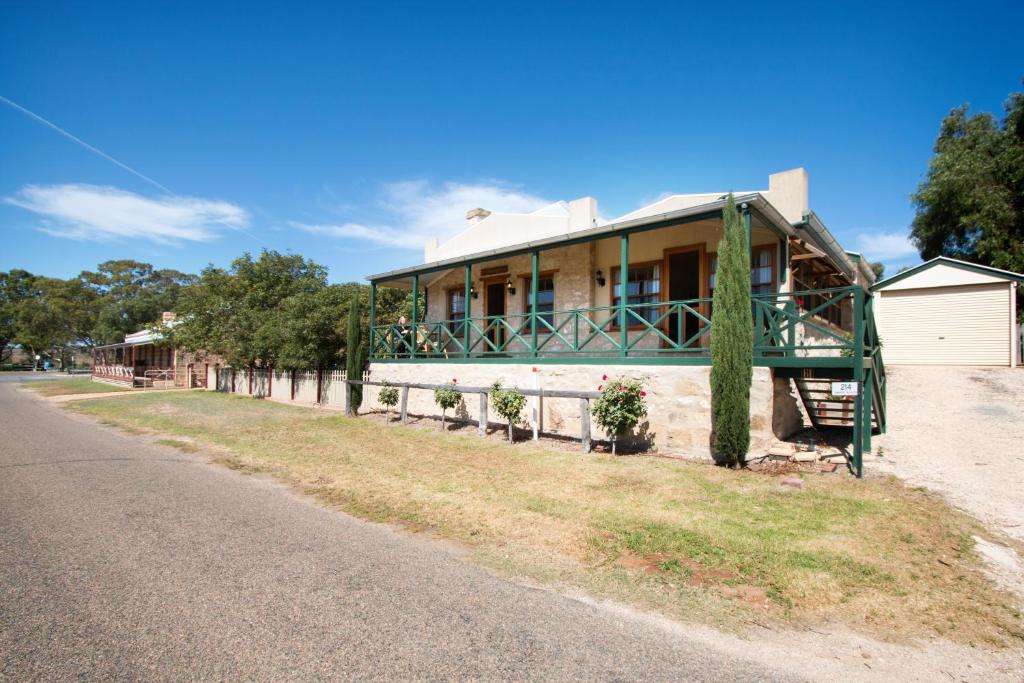 a house on the side of a road at Old Swanport General Store, Swanport-Murray River in Swanport