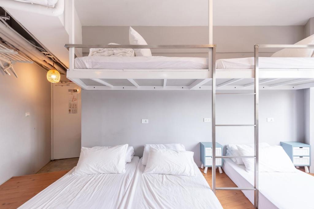 Postel nebo postele na pokoji v ubytování May Rooms Taipei Main Station