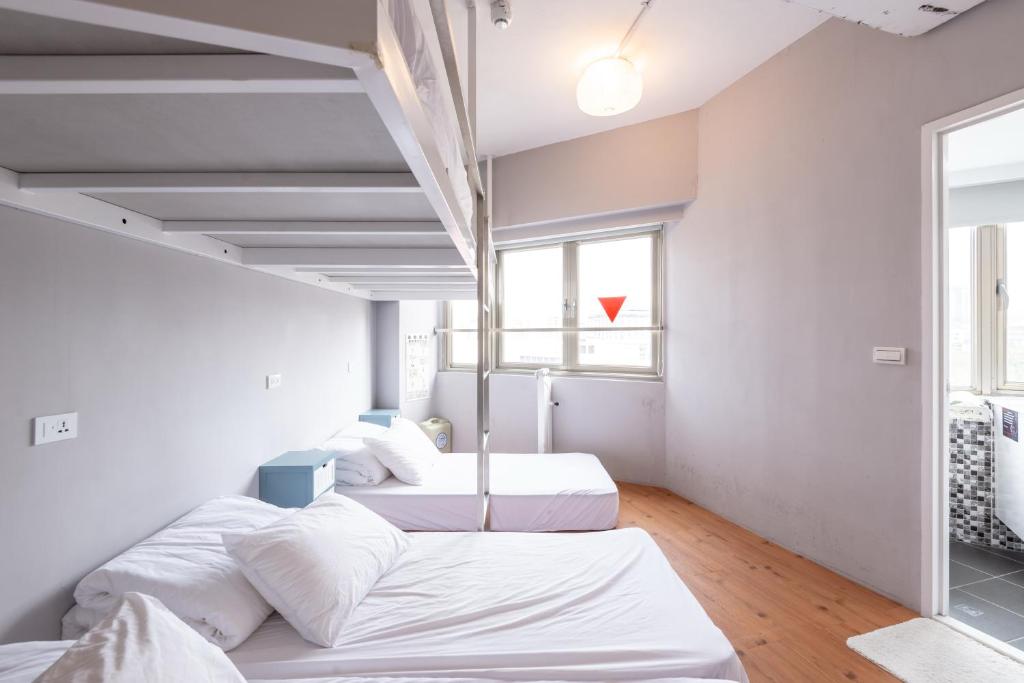 Postel nebo postele na pokoji v ubytování May Rooms Taipei Main Station
