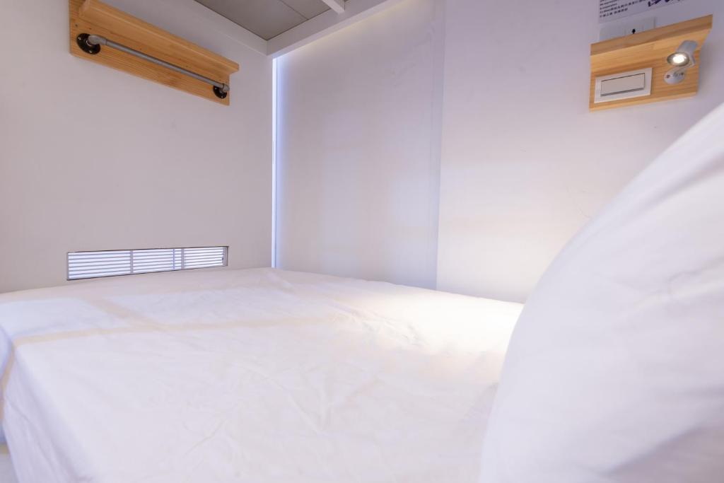 Postel nebo postele na pokoji v ubytování May Rooms Taipei Main Station