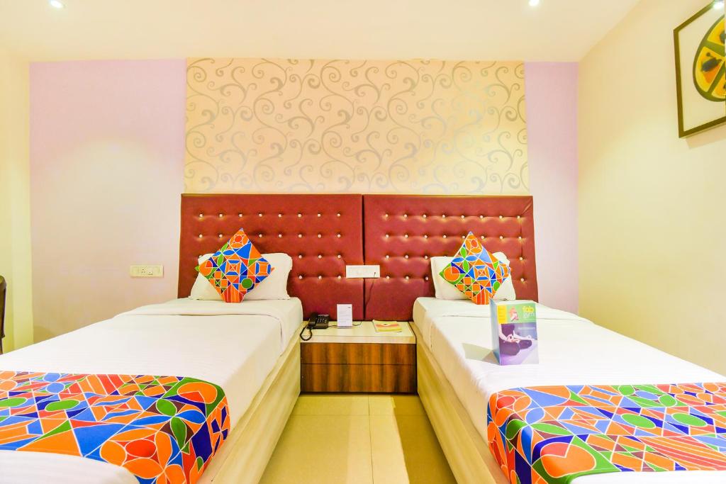 Postel nebo postele na pokoji v ubytování FabHotel Pentagon Next - Bhubaneswar Railway Station