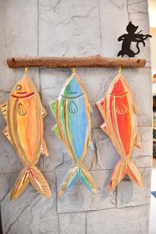 a group of four kites hanging on a wall at Kenting Garden Homestay in Kenting