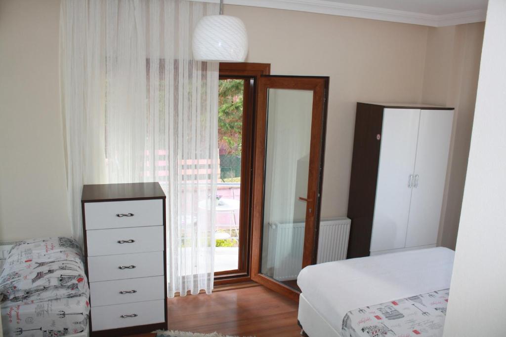 A bed or beds in a room at Sapphire Hotel