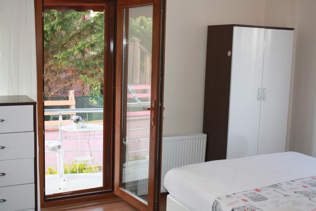 A bed or beds in a room at Sapphire Hotel