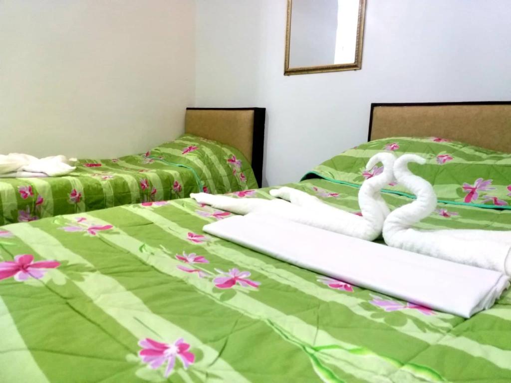 Postel nebo postele na pokoji v ubytování AMBIANZA APARTELLE