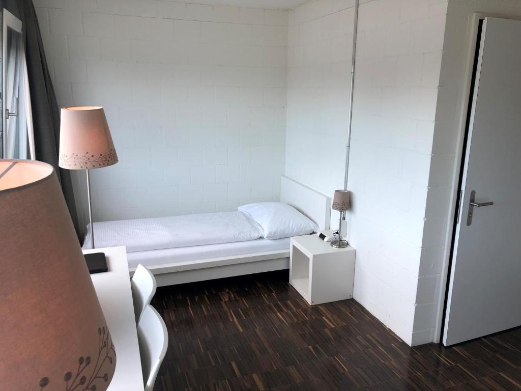 Una cama o camas en una habitación de Omnium Sport Hotel