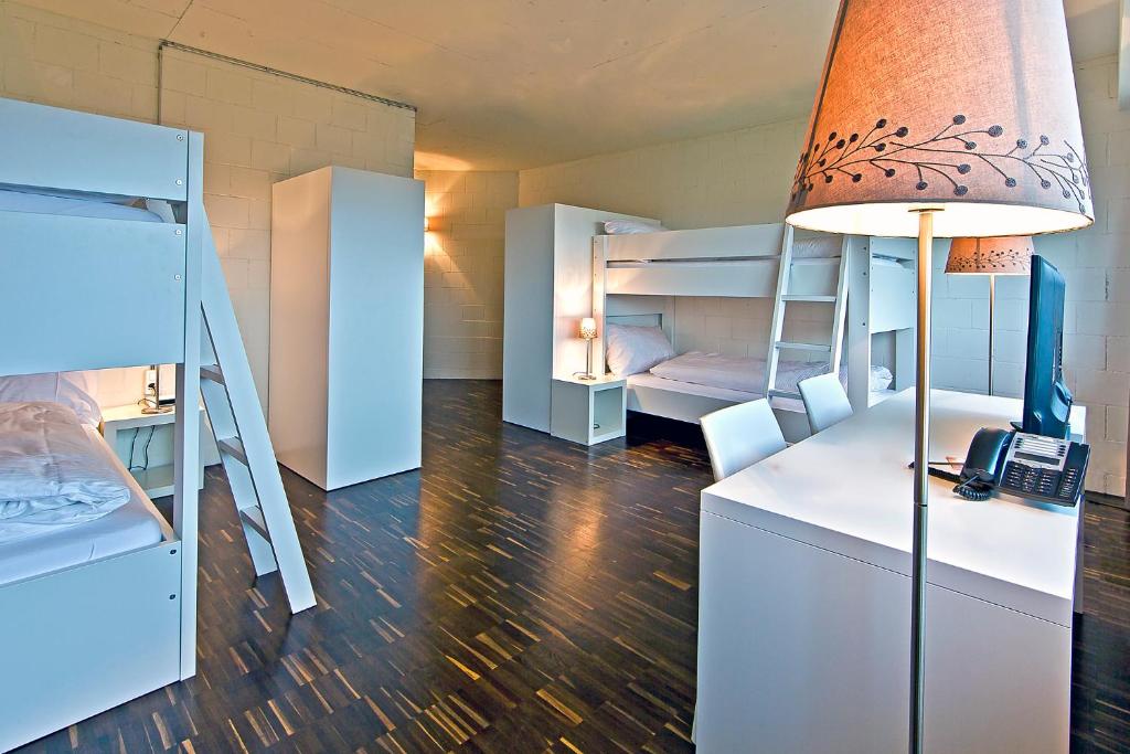 Una cama o camas en una habitación de Omnium Sport Hotel