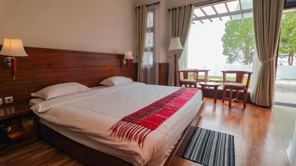 Postel nebo postele na pokoji v ubytování Taman Simalem Resort