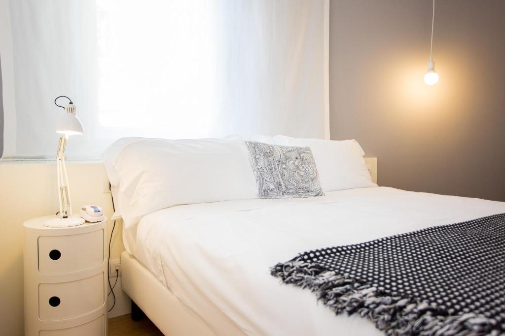 Postel nebo postele na pokoji v ubytování Hotel Solemare