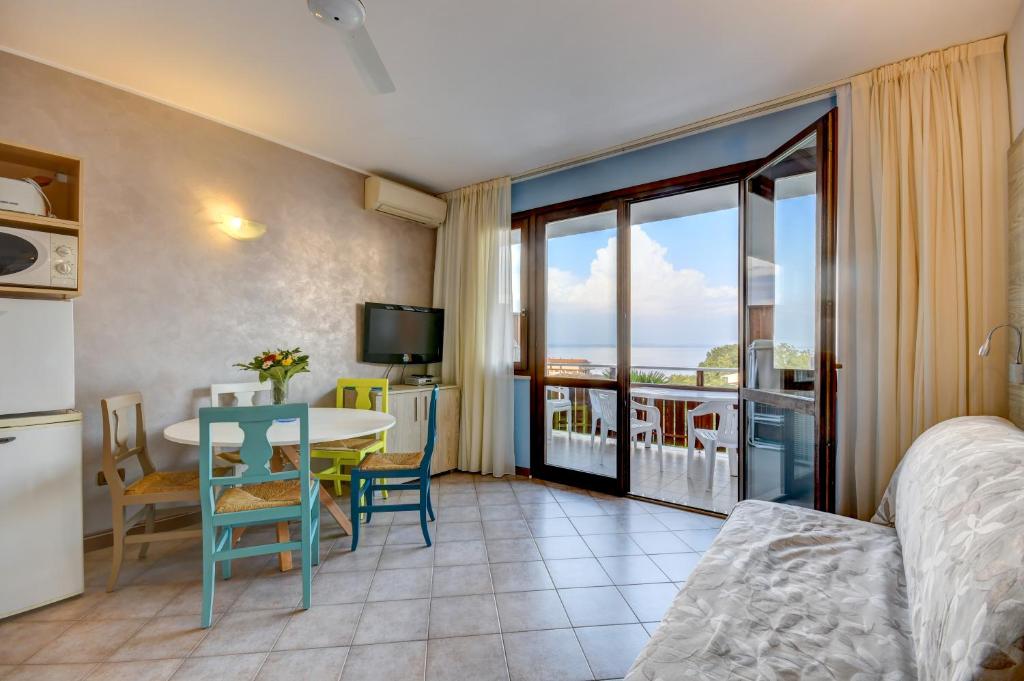 TV a/nebo společenská místnost v ubytování Apparthotel San Sivino