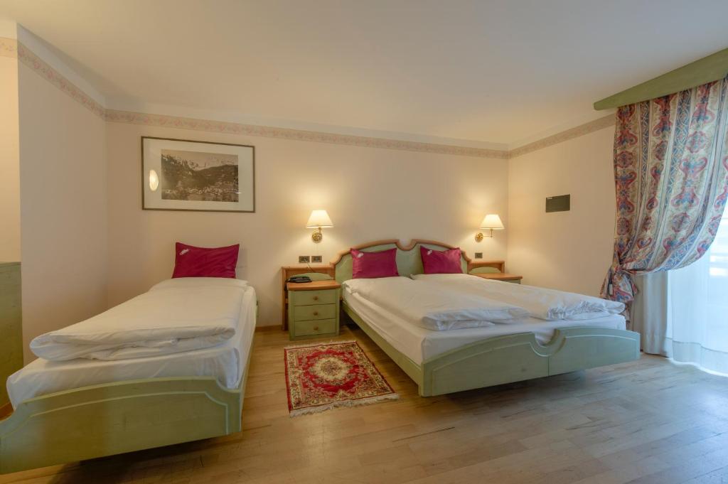 Postel nebo postele na pokoji v ubytování Albergo Alla Rosa
