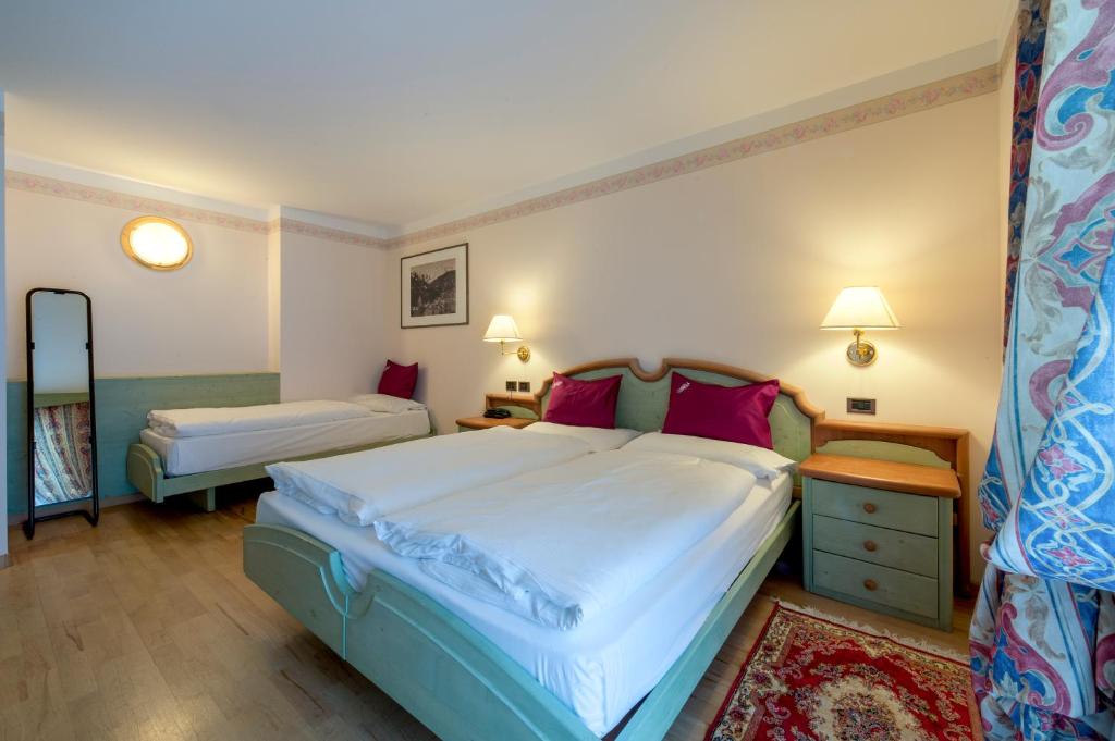 Postel nebo postele na pokoji v ubytování Albergo Alla Rosa