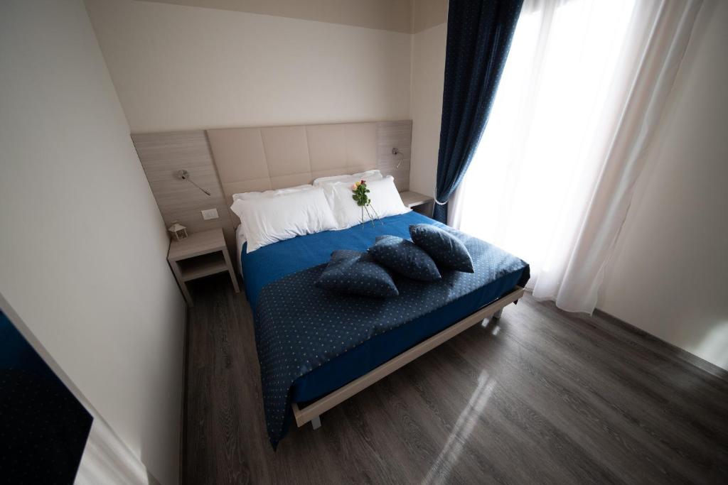 Postel nebo postele na pokoji v ubytování HOME HOTEL