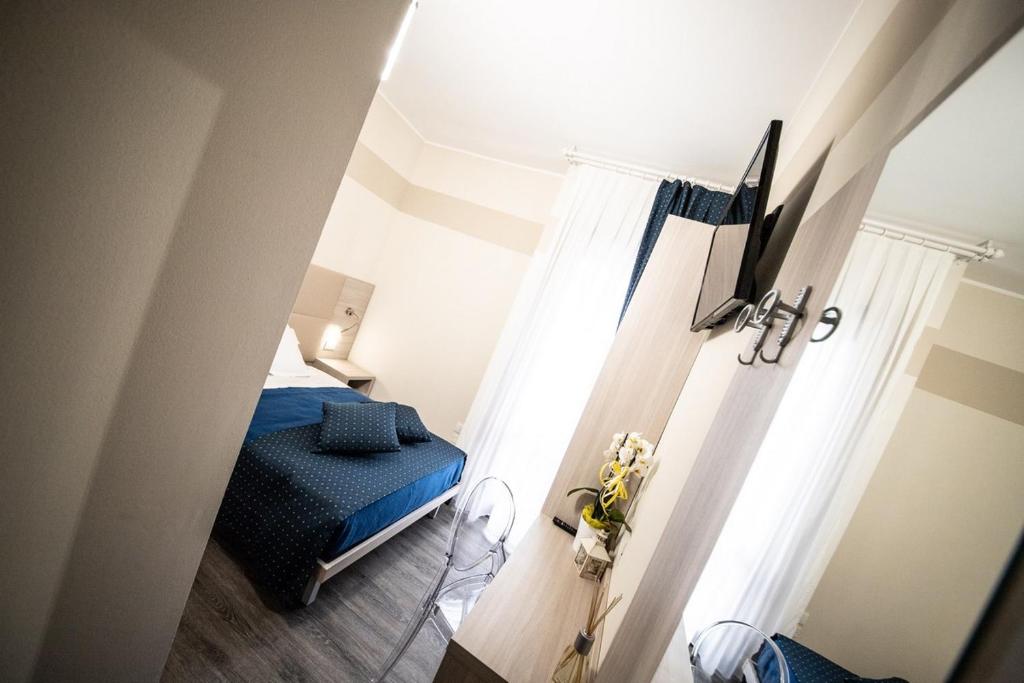 Postel nebo postele na pokoji v ubytování HOME HOTEL