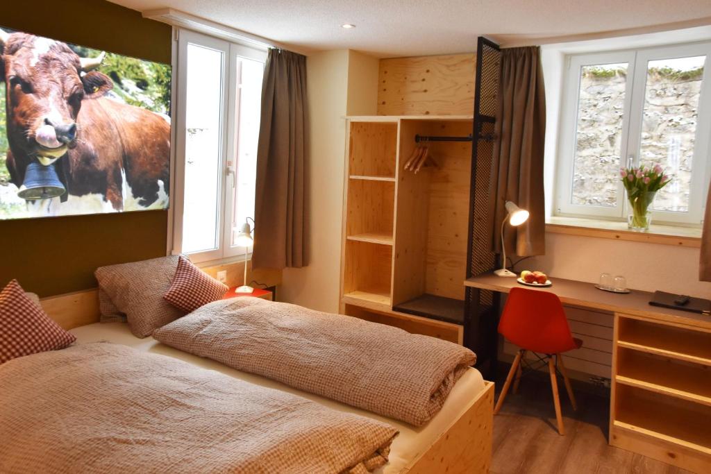 Letto o letti in una camera di Eiger Guesthouse