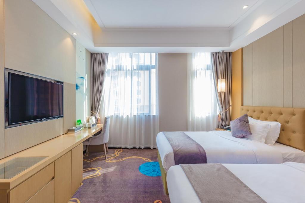 TV a/nebo společenská místnost v ubytování Taishan He Style Hotel