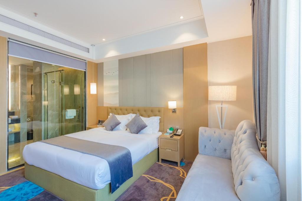 Postel nebo postele na pokoji v ubytování Taishan He Style Hotel