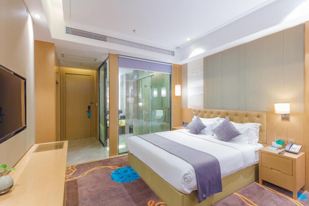 Postel nebo postele na pokoji v ubytování Taishan He Style Hotel