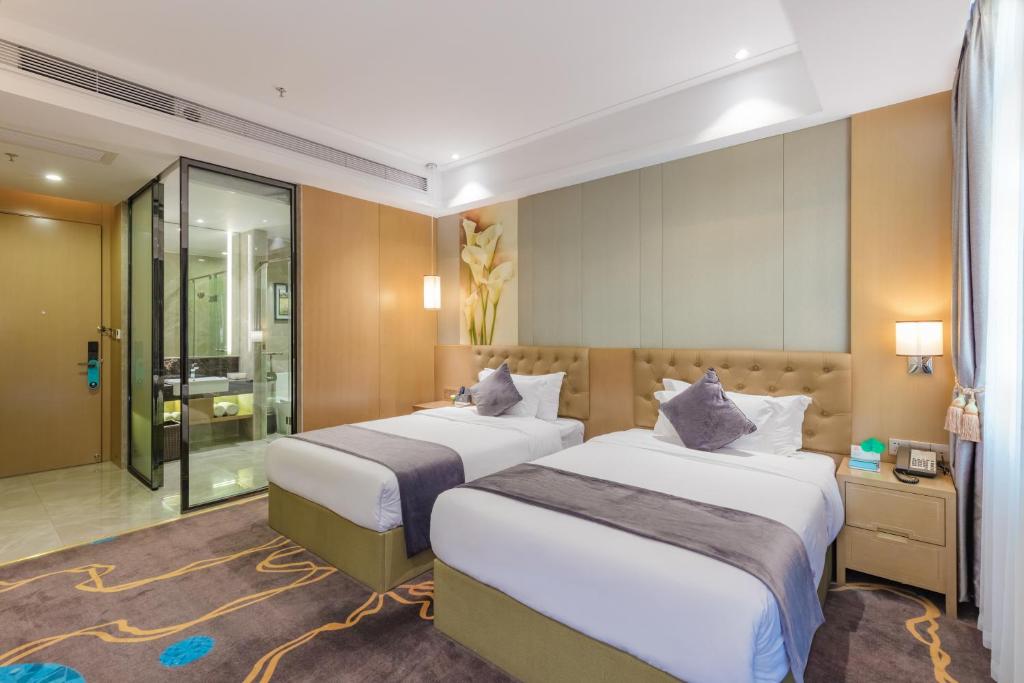 Postel nebo postele na pokoji v ubytování Taishan He Style Hotel