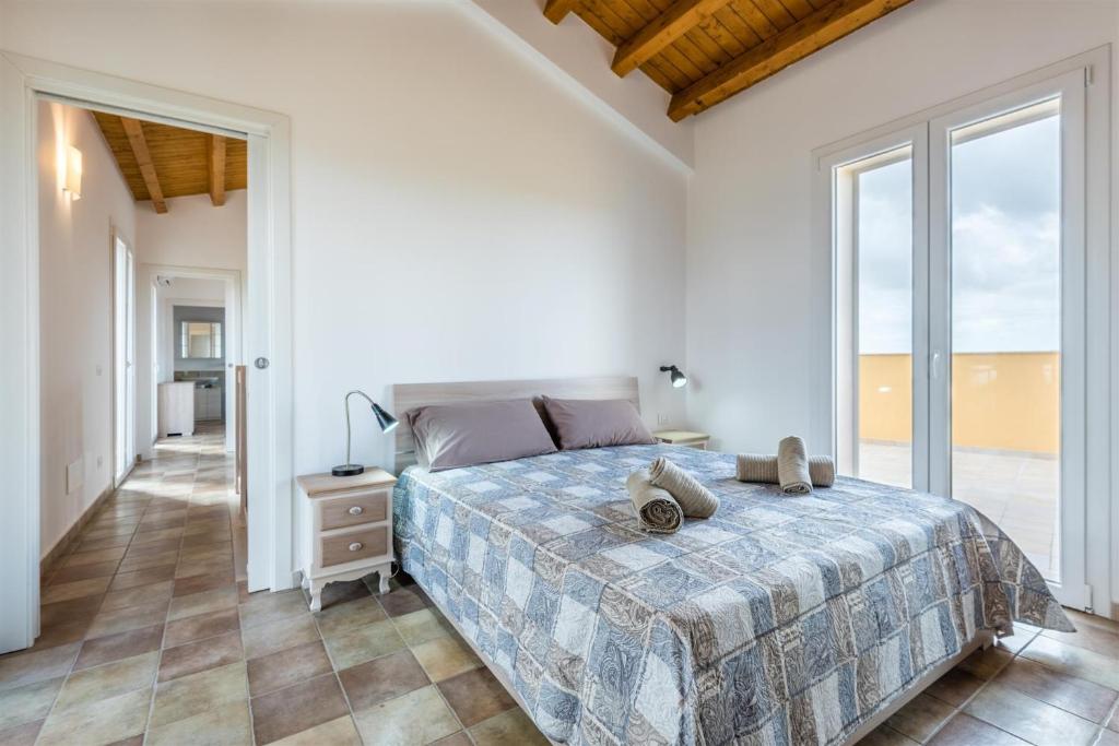 Posteľ alebo postele v izbe v ubytovaní Dimora Villa Ada