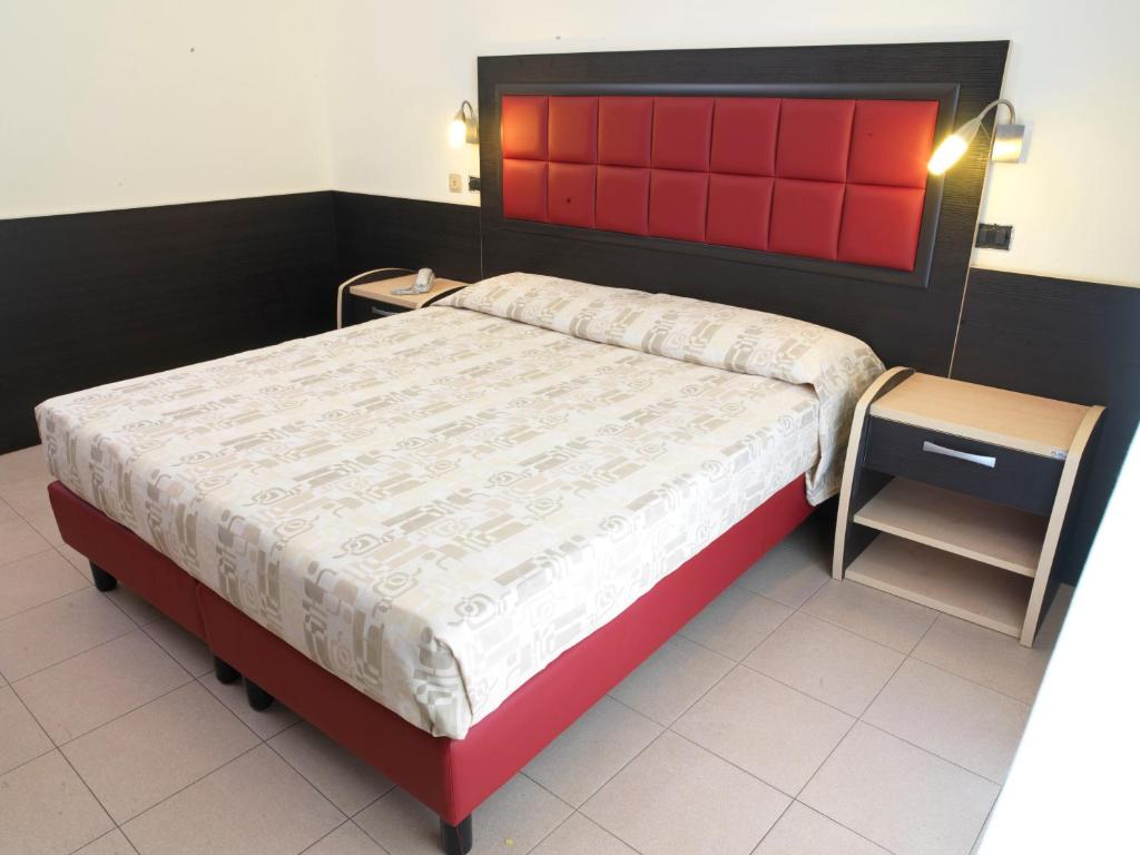 Postel nebo postele na pokoji v ubytování Hotel Arno