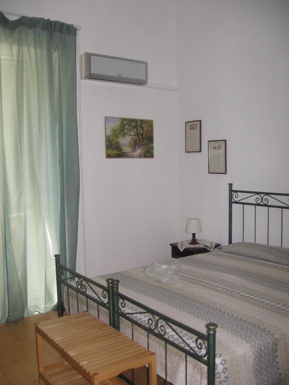 Postel nebo postele na pokoji v ubytování B&B Domus Gaetani