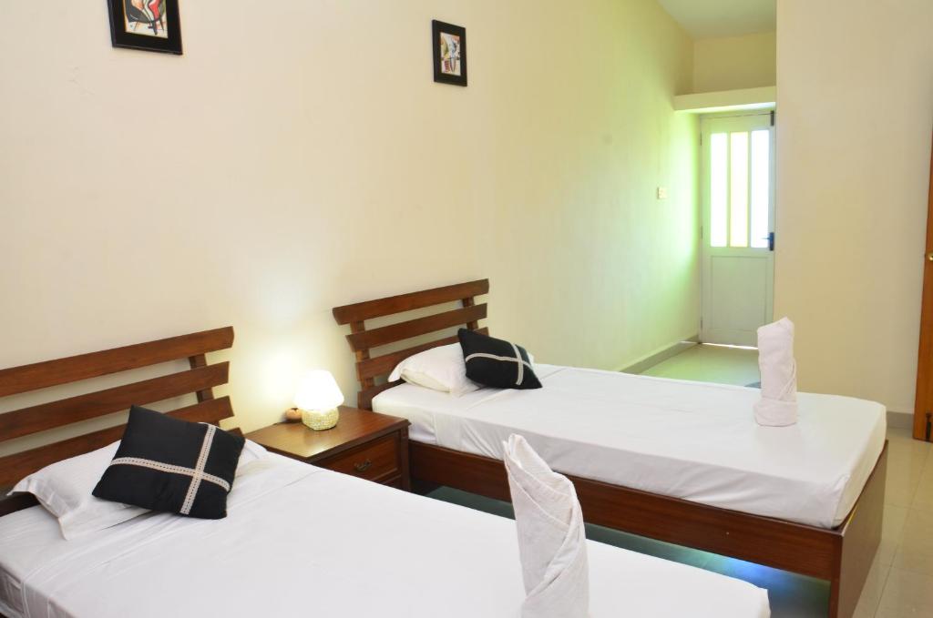 Кровать или кровати в номере A's Holiday Beach Resort