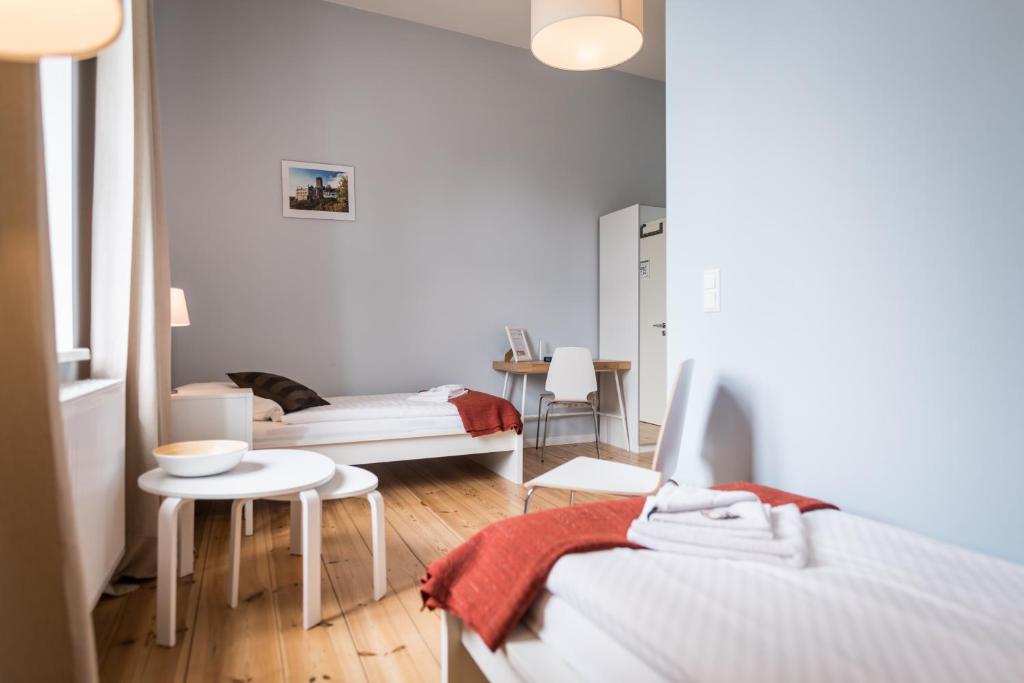 Postel nebo postele na pokoji v ubytování Johanniterhaus Wittenberg