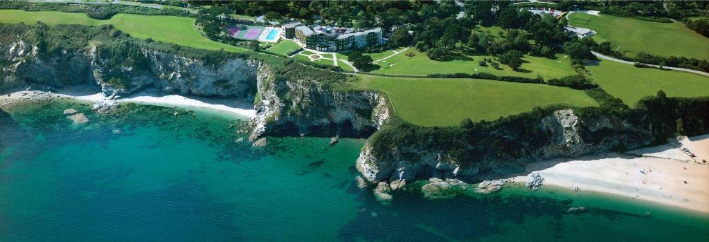 an aerial view of a beach and the ocean at The Carlyon Bay Hotel and Spa in St Austell