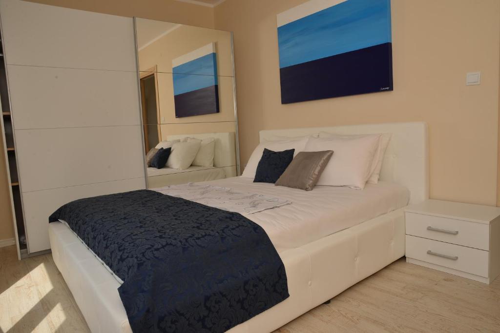 Postel nebo postele na pokoji v ubytování Apartments Mianiko